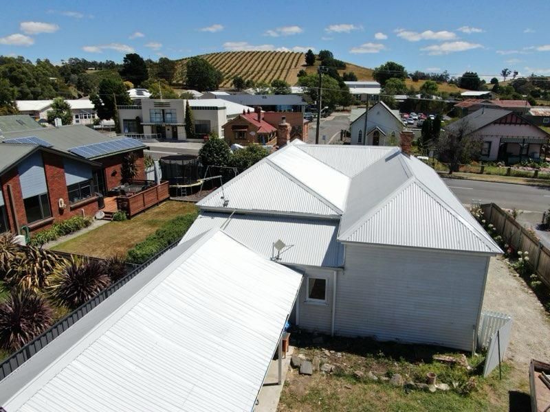 picture of house with completed roof replacement from back view in launceston