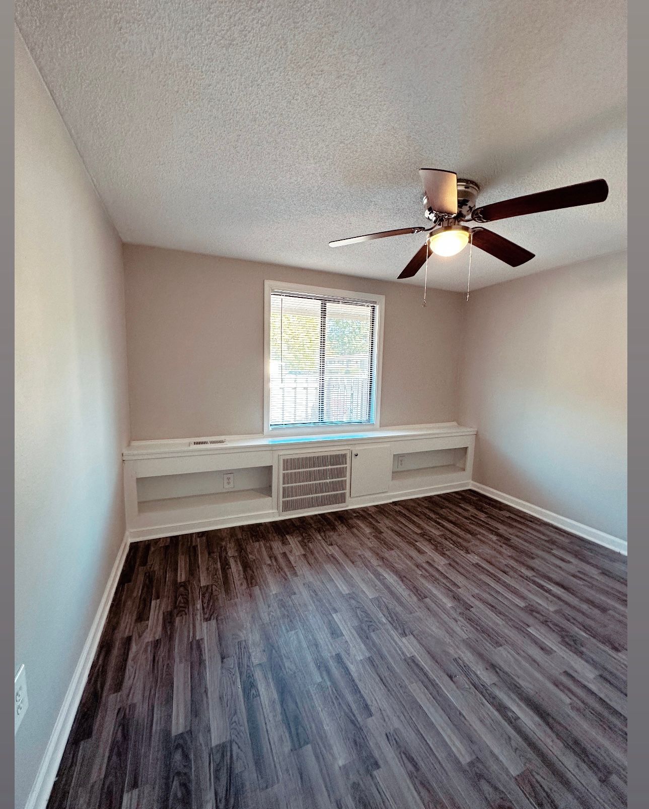 Photo of a beddroom with built-in shelving