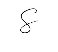 Black hand-drawn looping number or symbol on a white background