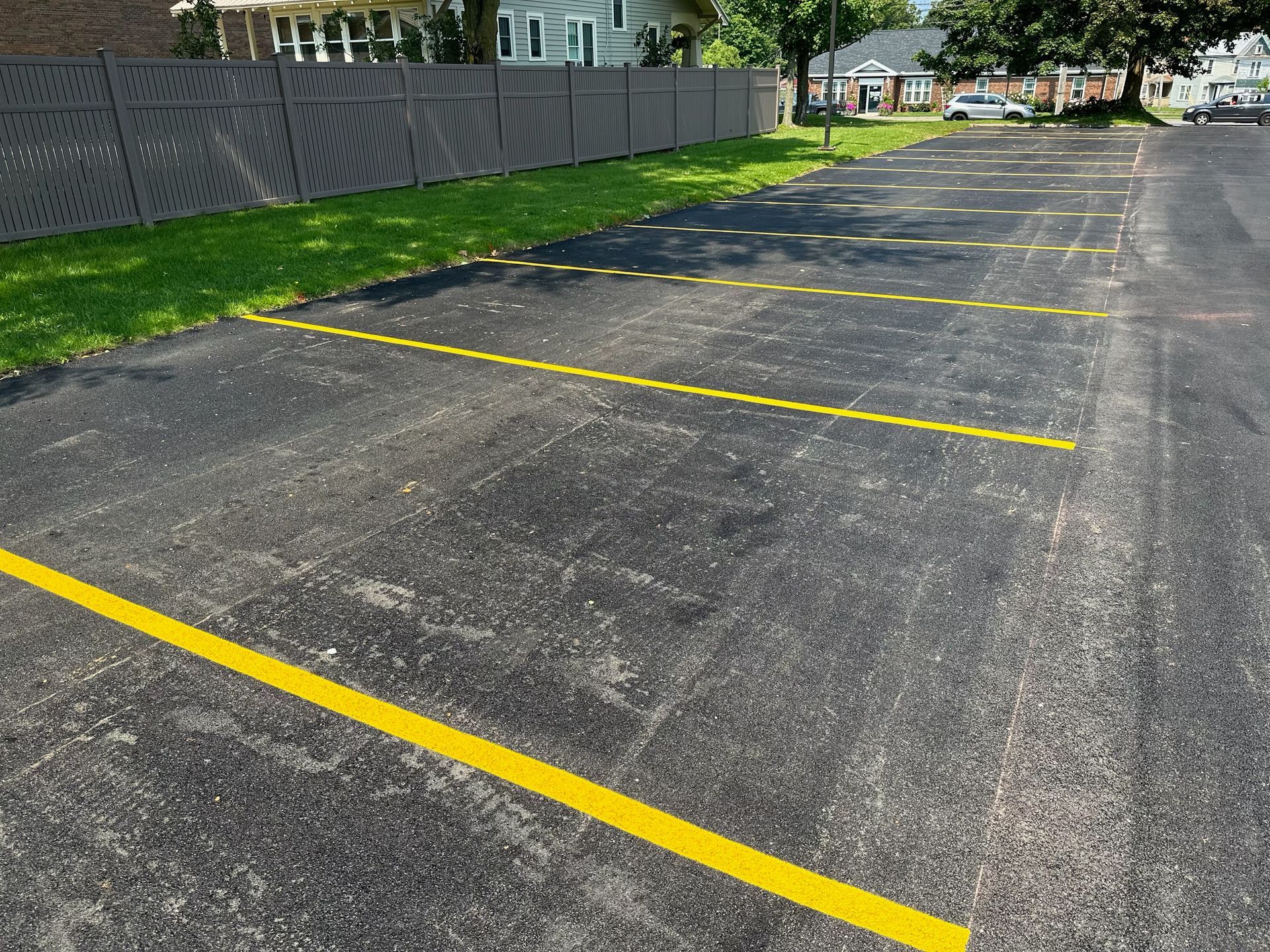 A parking lot with yellow lines painted on it