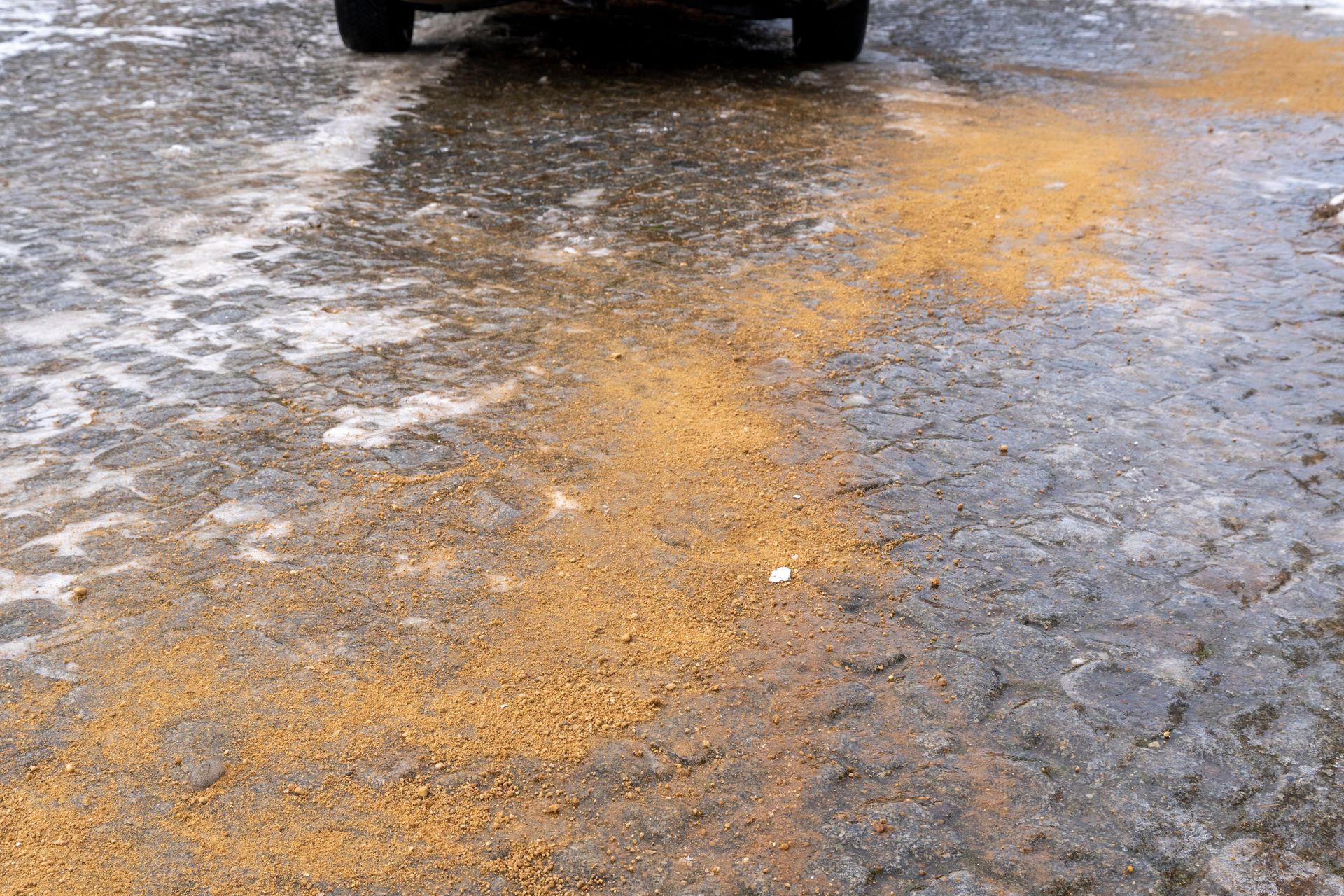 A car is driving on a slippery road.