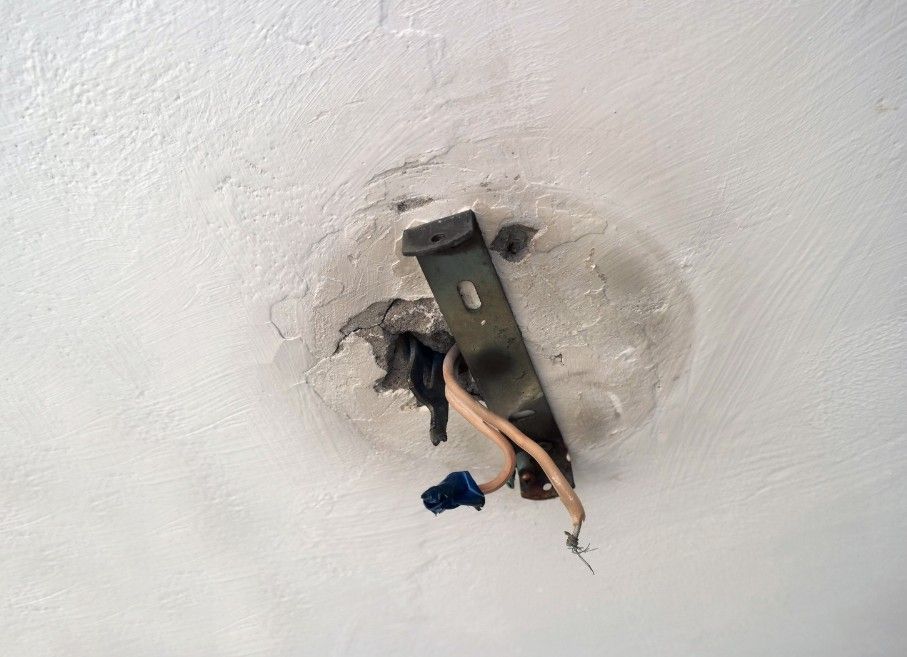 Derbyshire Electrical Specialists checking the wiring for a light for a landlord in Derby