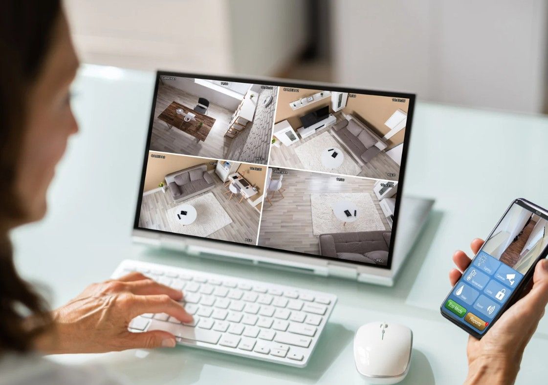 Derbyshire Electrical Specialists customer checking her home security cameras at work in Derby