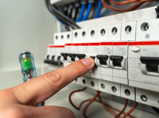 Electrician carrying out fixed wire testing in Derby