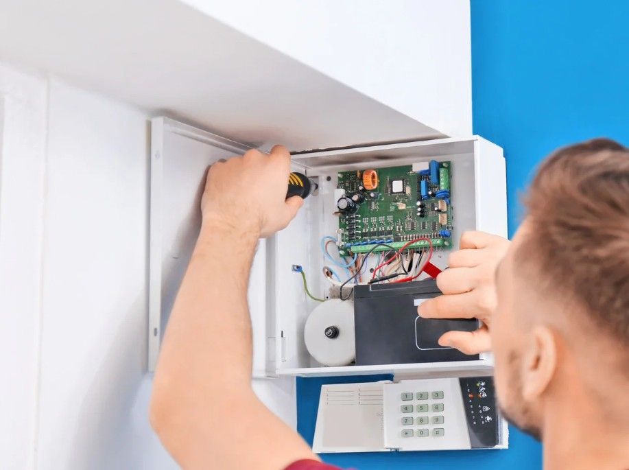 Derbyshire Electrical Specialists installing a house burglar alarm in Derby