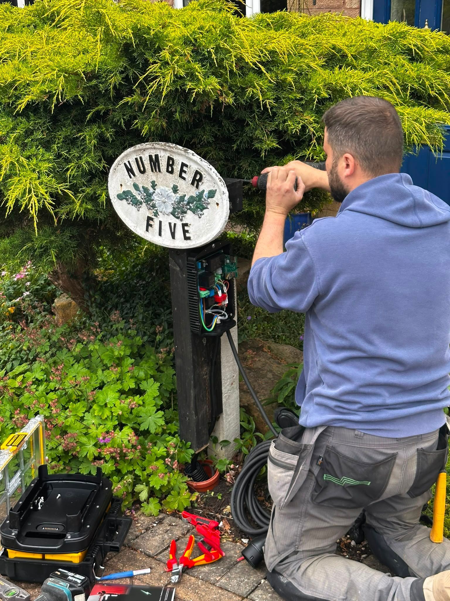 Derbyshire Electrical Specialists installing a home EV charger for a customer in Ilkeston, Derbyshire