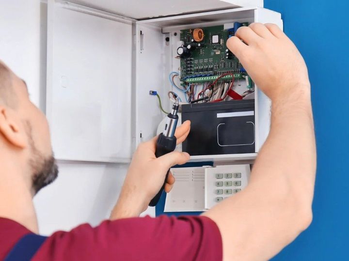 Derbyshire Electrical Specialists installing a home alarm system in Derby