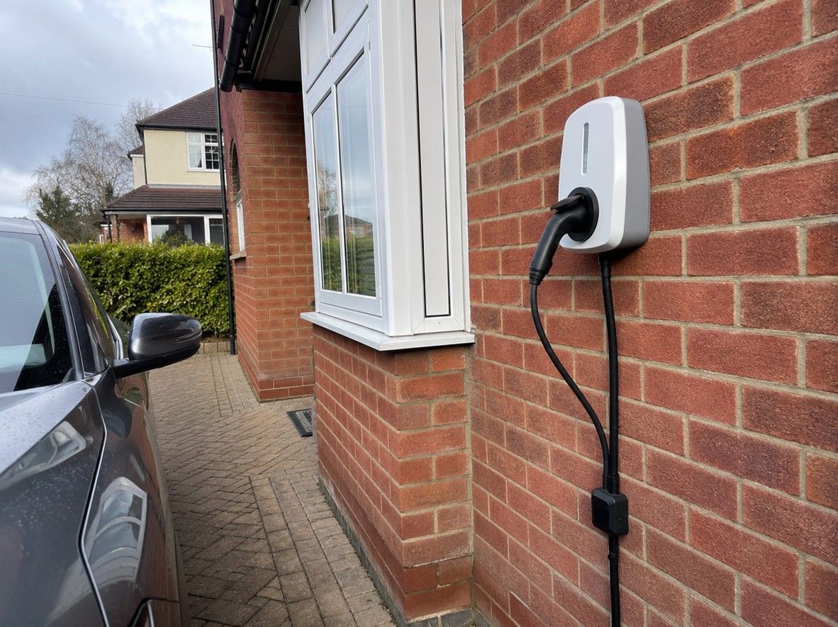 Home EV charger installed on the exterior wall of an Alfreton property by Derbyshire Electrical Specialists