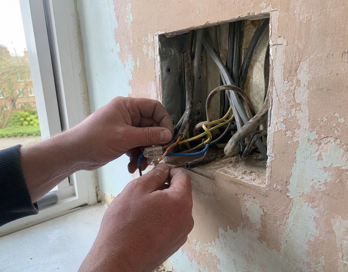Old rubber-sheathed wiring being replaced during a rewire at a Swadlincote property by Derbyshire Electrical Specialists