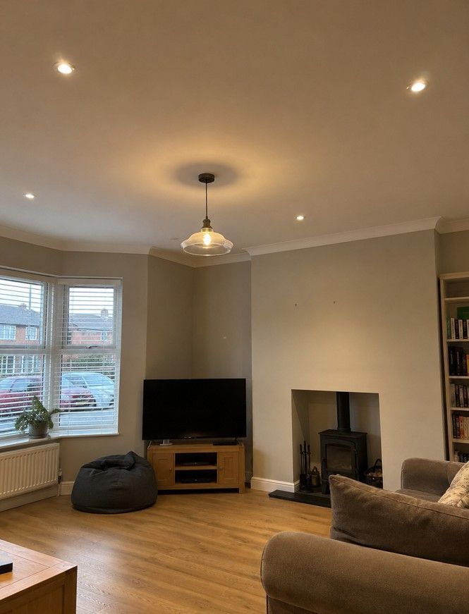 Recessed downlights and pendant lighting installed in a Derby living room by Derbyshire Electrical Specialists