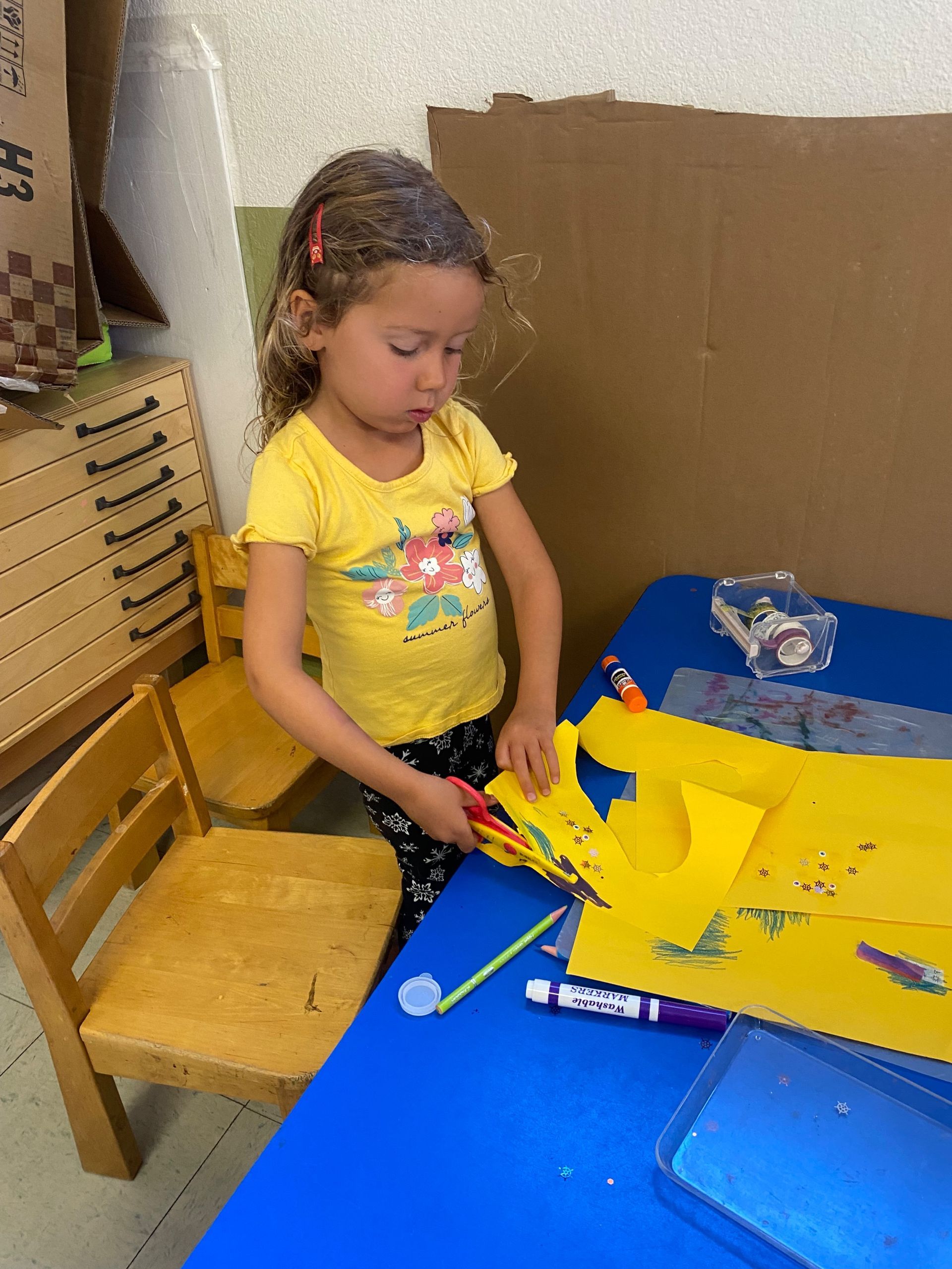 montessori child working with craft activity