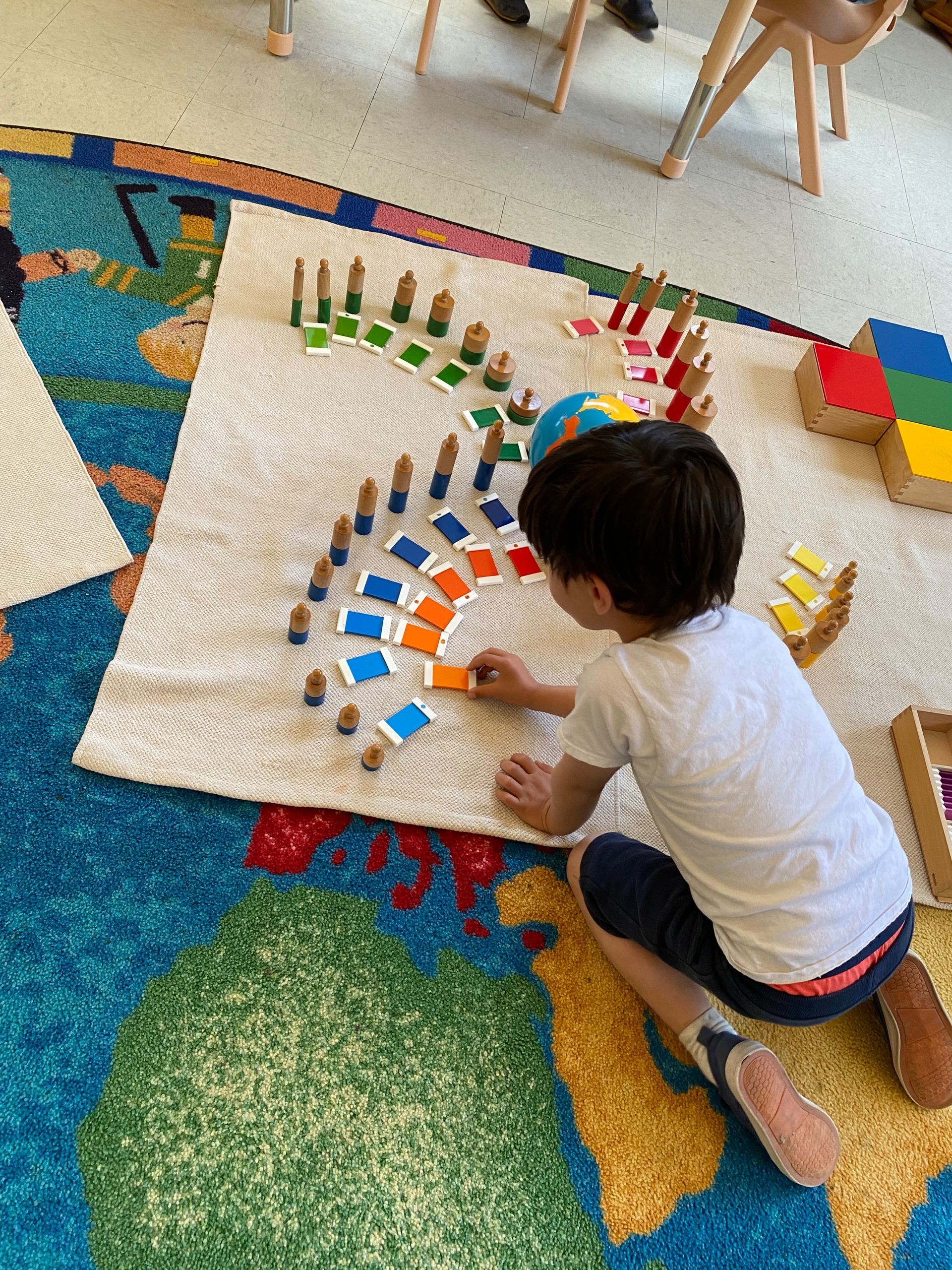 montessori child working with sensorial activity