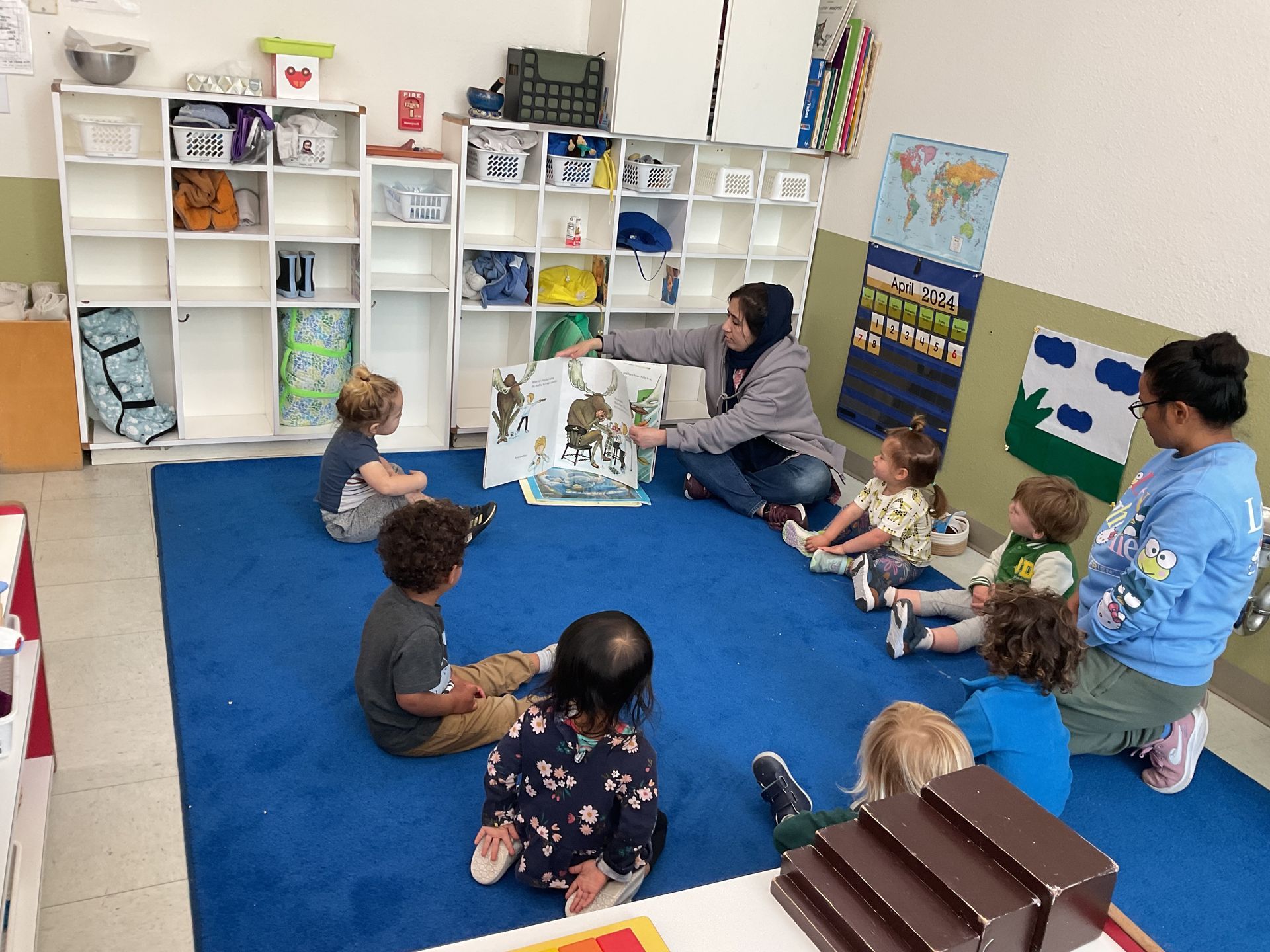 montessori children with guide inside the sandpiper classroom
