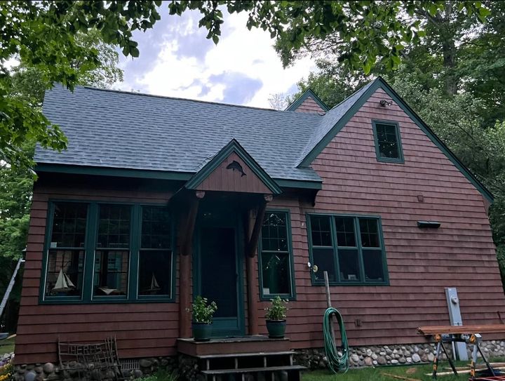 Shingle roofing installation in Curtis, Michigan, using high-quality Atlas shingles by expert Northern Michigan roofing specialists.