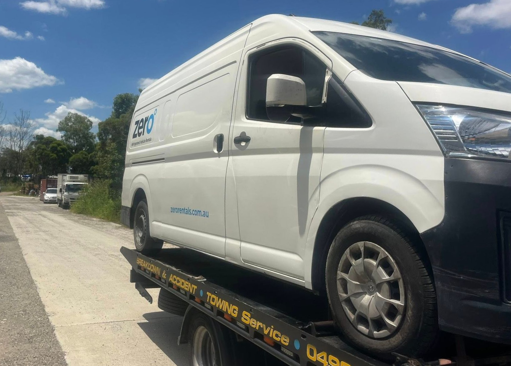 White Service Van on a Tow Truck on a Roadside Under a Blue Sky — A B & Forge Towing In Bribie Island, QLD