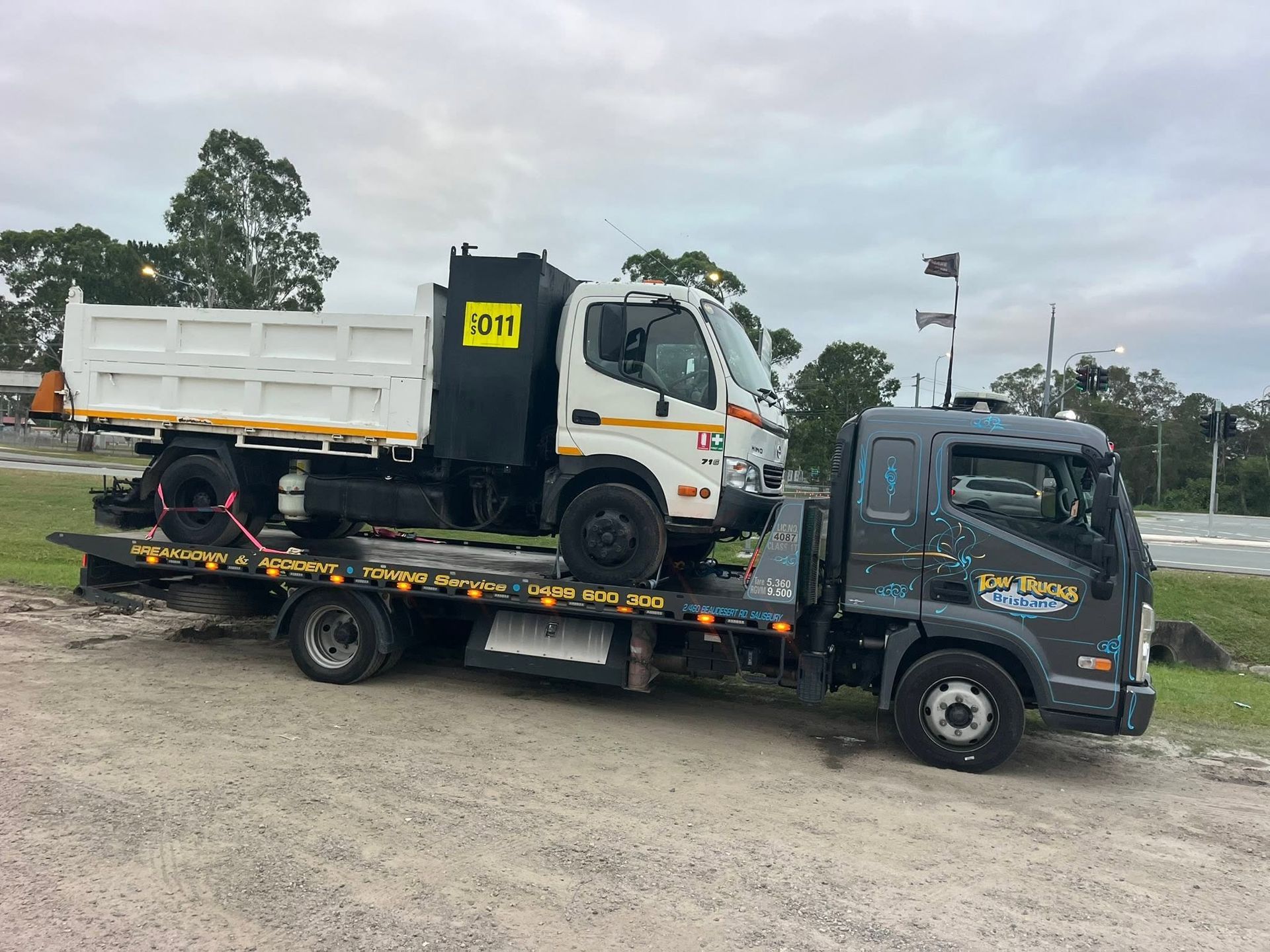 Tow Truck Carrying a White Dump Truck — A B & Forge Towing In Burpengary, QLD