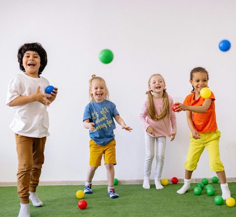 Children celebrating with party blowers.