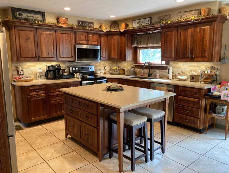A kitchen with a large island in the middle of it.