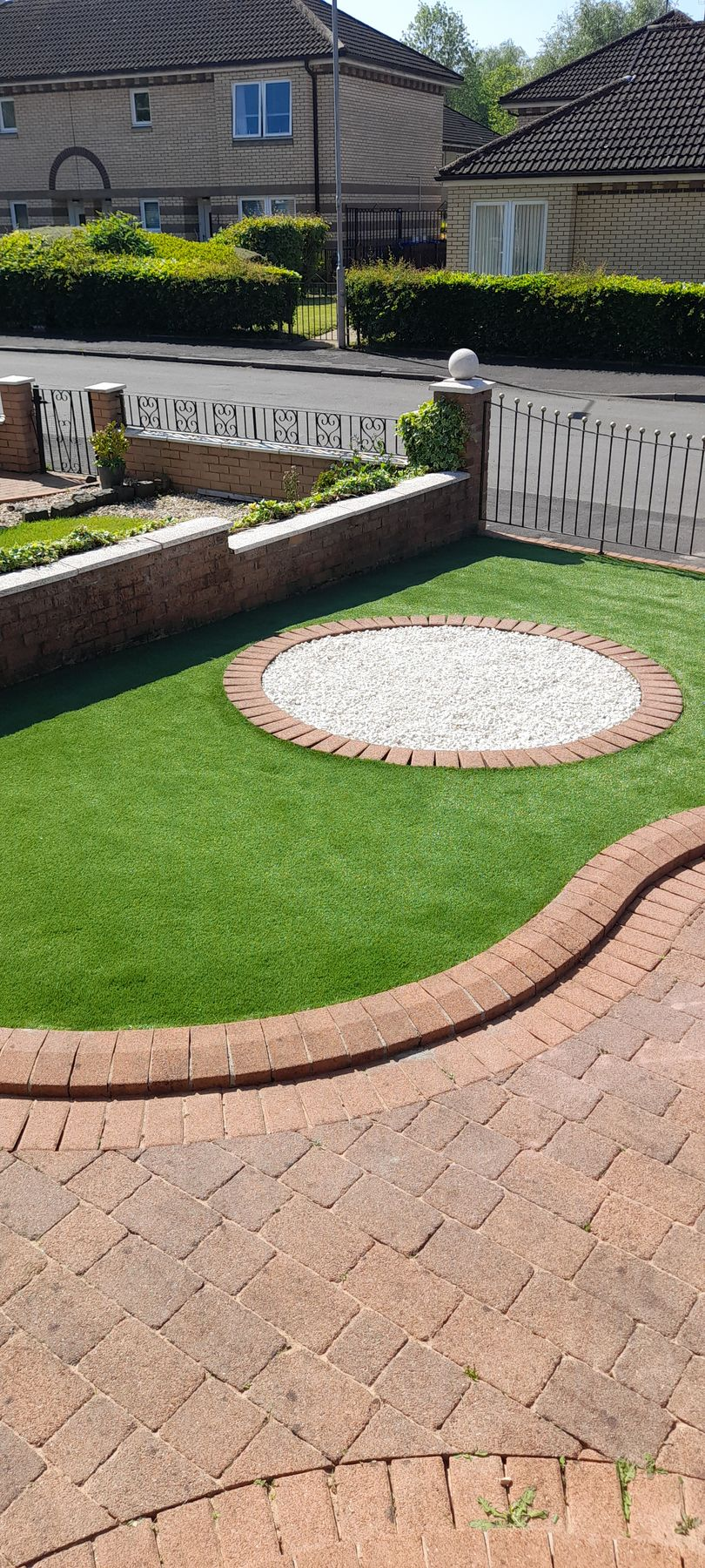Walk way with perfect grass landscaping with artificial grass in residential area