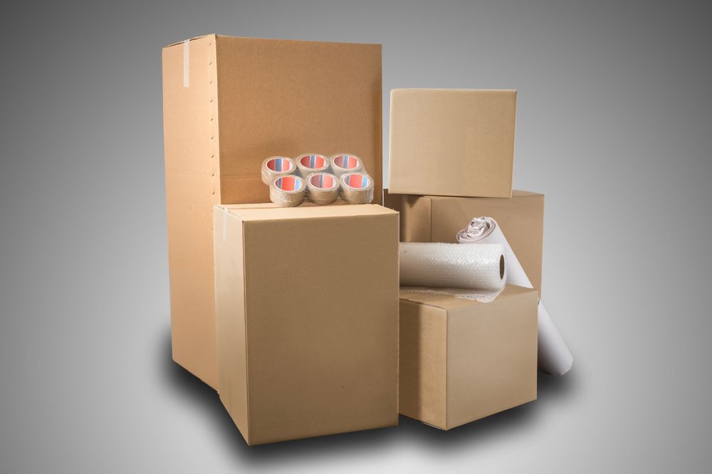 A Group of Cardboard Boxes Stacked on Top of Each Other — Mackay Cleaning & Packaging Supplies in Mackay, QLD