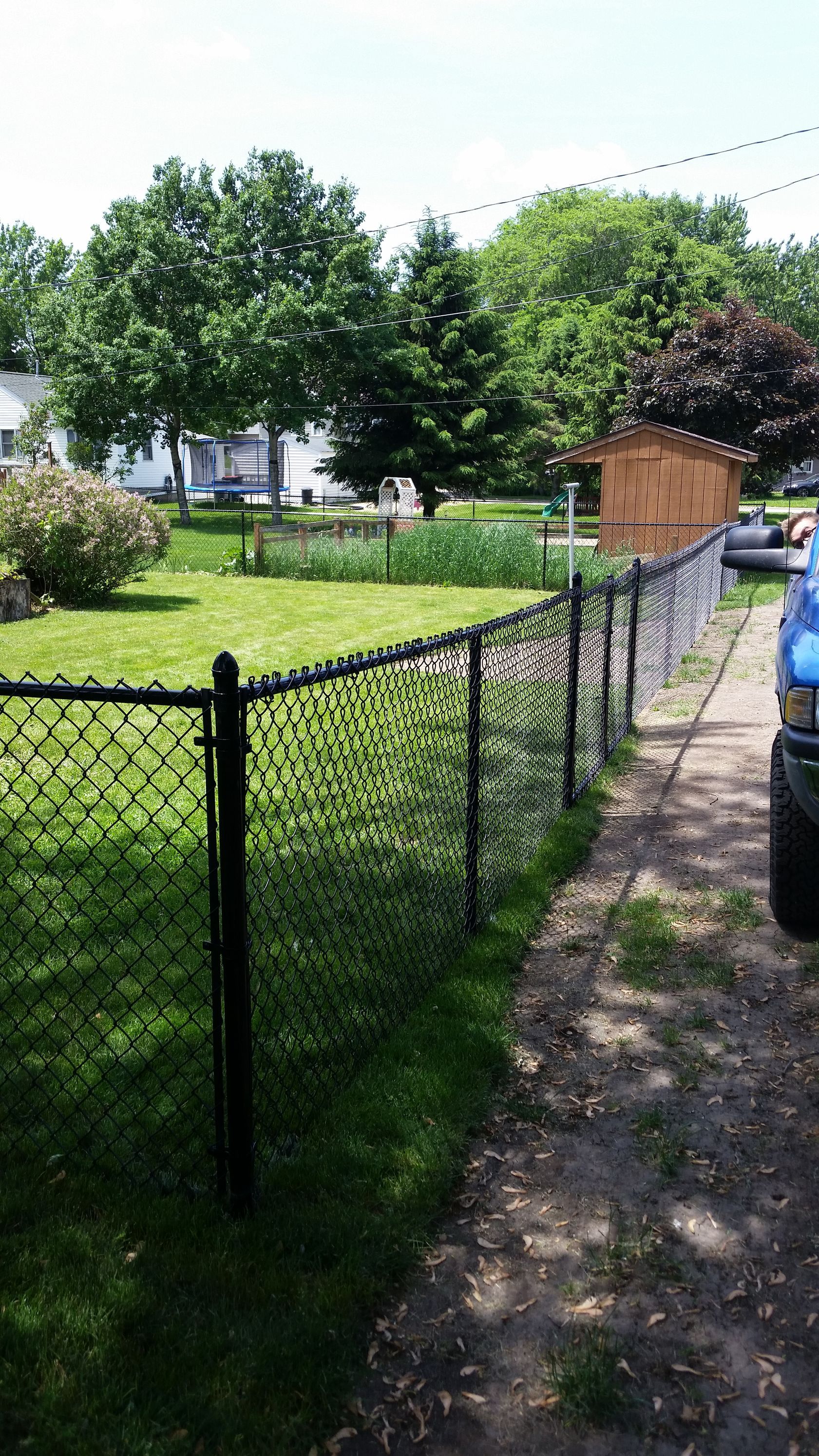 Black Chain On A Backyard | Rochester, MN | The Fence Pro’s