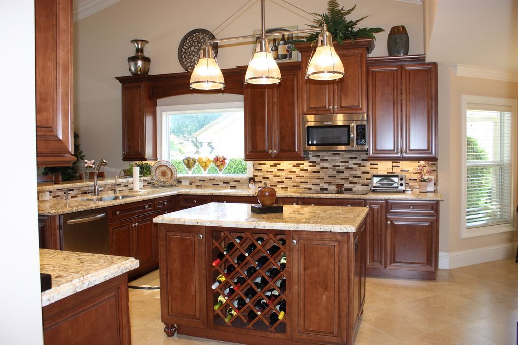 A kitchen with a wine rack on the island