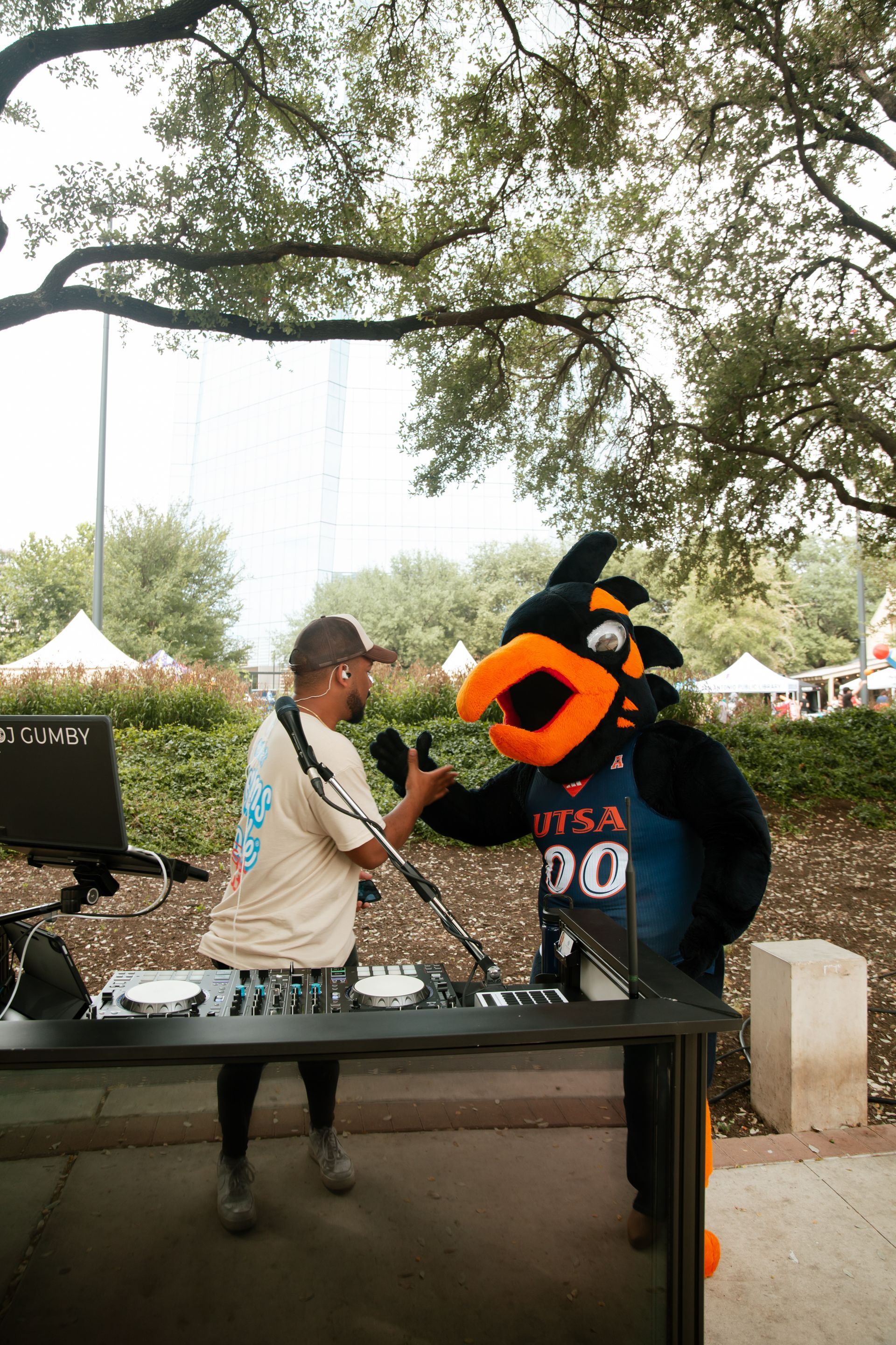 Gaines Entertainment DJ Gumby at a community event in San Antonio with Rowdy the Roadrunner