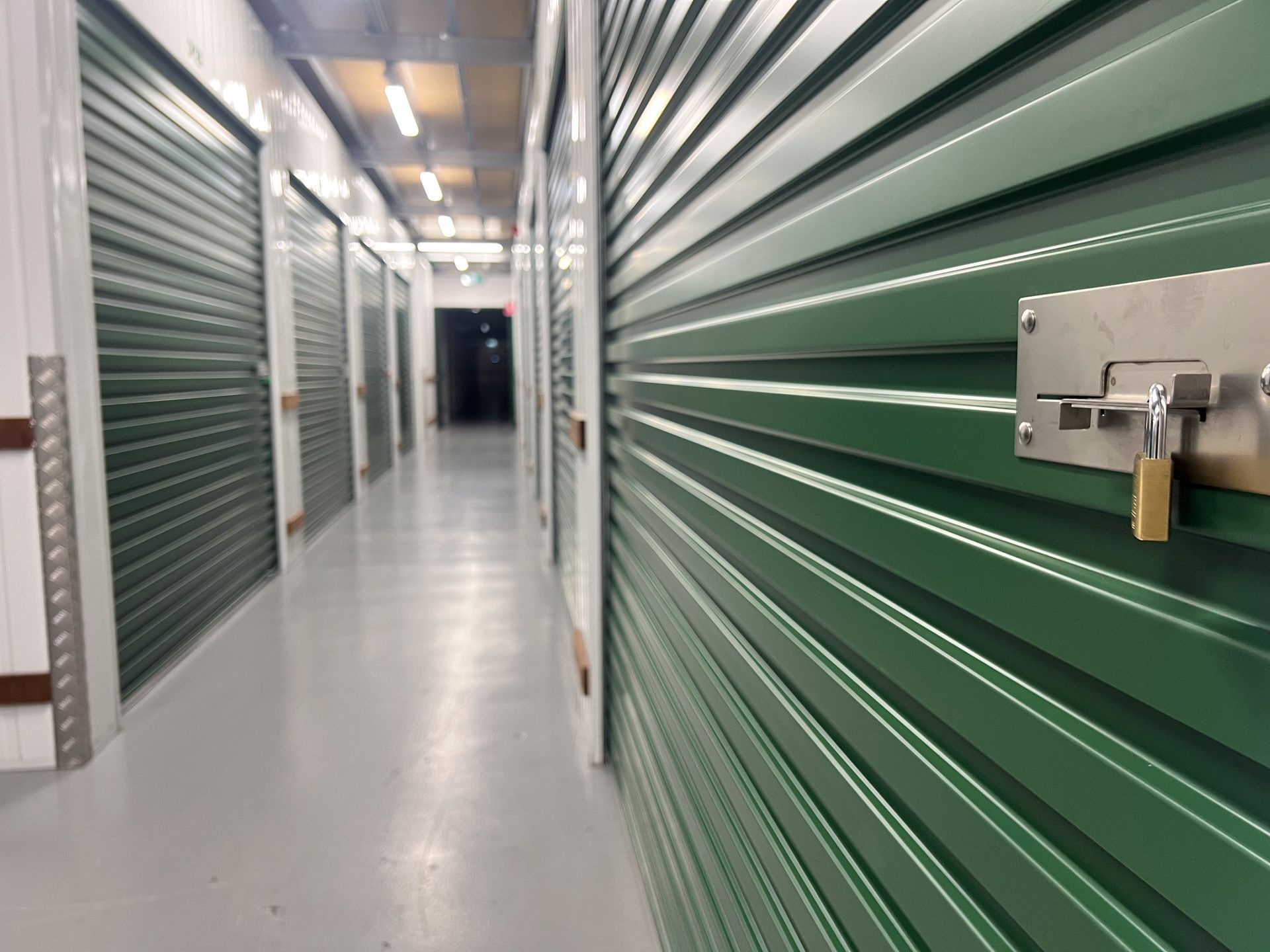 Empty corridor with self-storage rooms - Climate Controlled Self-Storage Facility