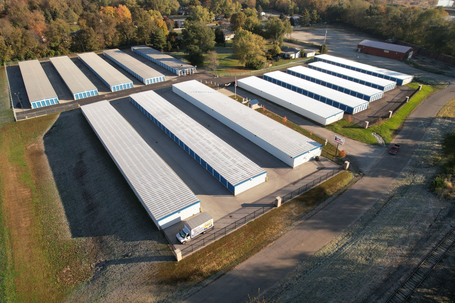 Storage Solutions's North storage units — Storage in Terre Haute, IN Aerial view of a storage facility with rows of blue and white storage units.