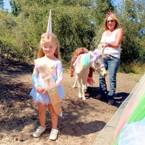 crowning the birthday girl at a unicorn birthday party in san diego