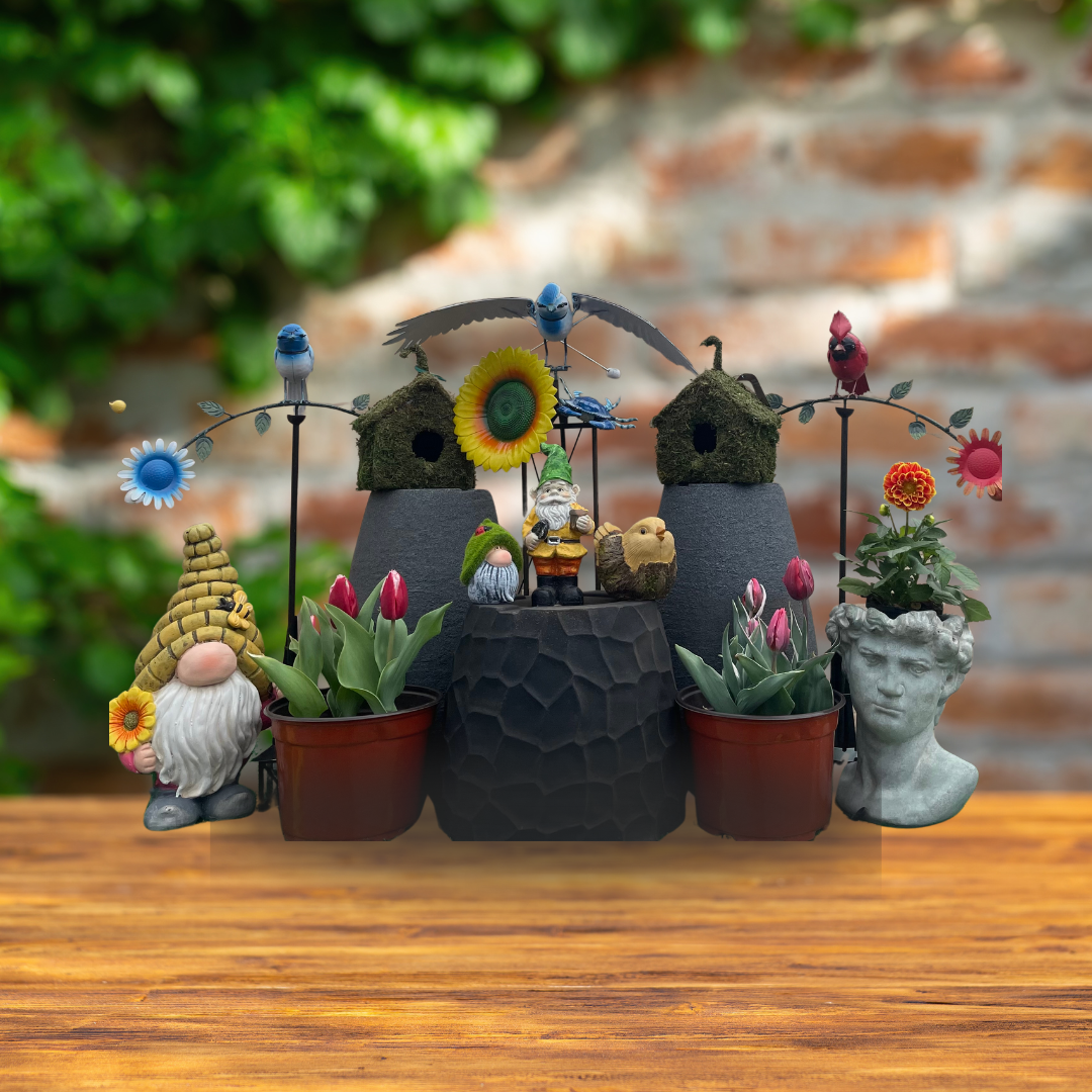 Garden scene with gnome, birdhouses, flowers, pots, and statue on wooden surface.