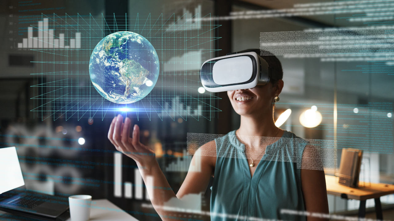 A woman wearing a virtual reality headset is holding a globe in her hands.