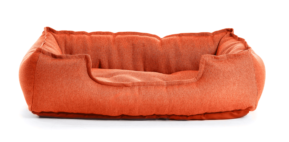 Orange dog bed on a white background.
