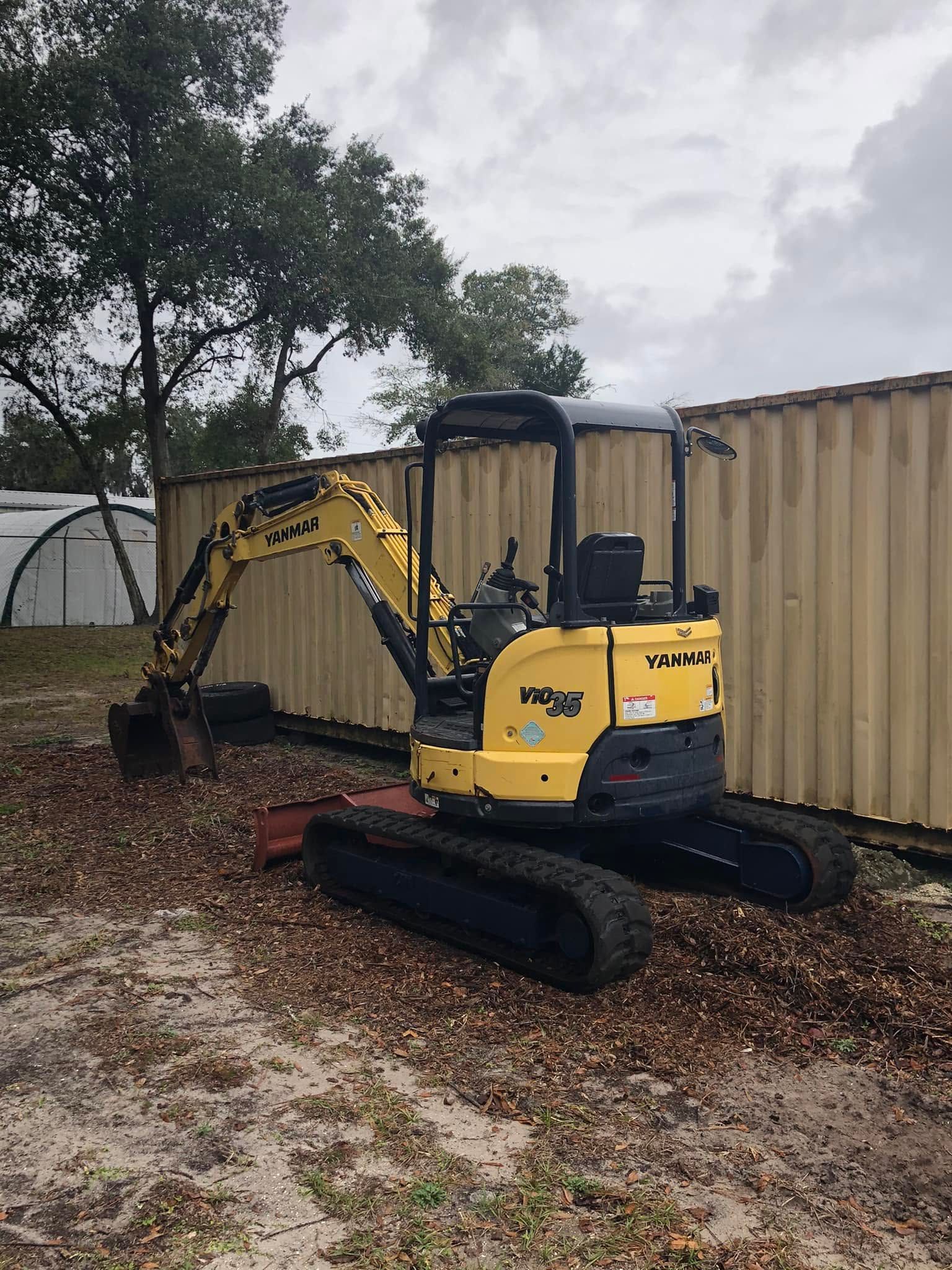 Yanmar compact excavator with thumb used by Jeff Mobley Tree Service