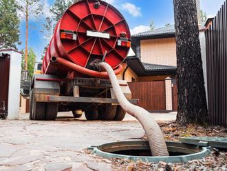 Septic Tank Truck is Pumping Water into a Manhole — North Branch, MN — Hassle Free Septic Septic Tank Truck is Pumping Water into a Manhole — North Branch, MN — Hassle Free Septic