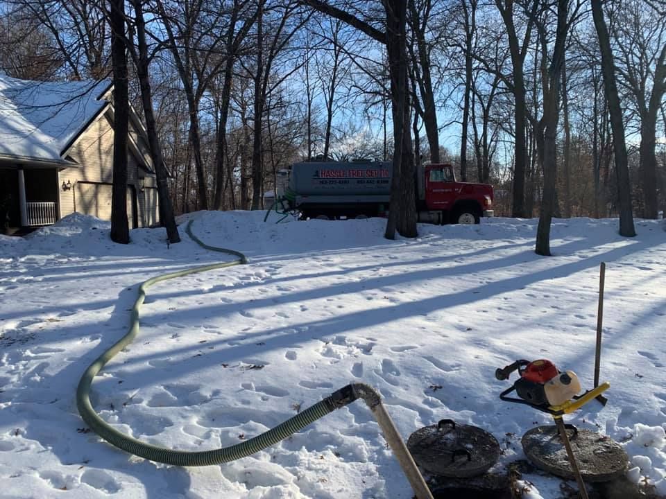 Septic Tank is in the Snow in Front of a House — North Branch, MN — Hassle Free Septic Septic Tank is in the Snow in Front of a House — North Branch, MN — Hassle Free Septic