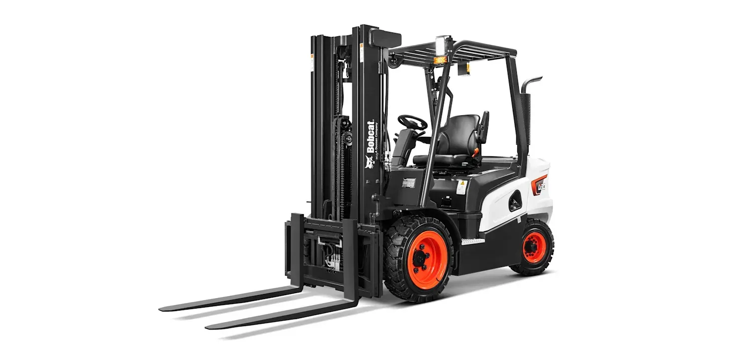 A forklift is sitting on a white surface.