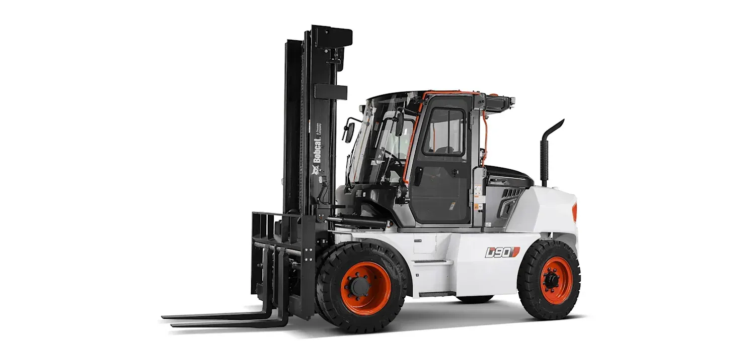 A forklift is sitting on a white surface.