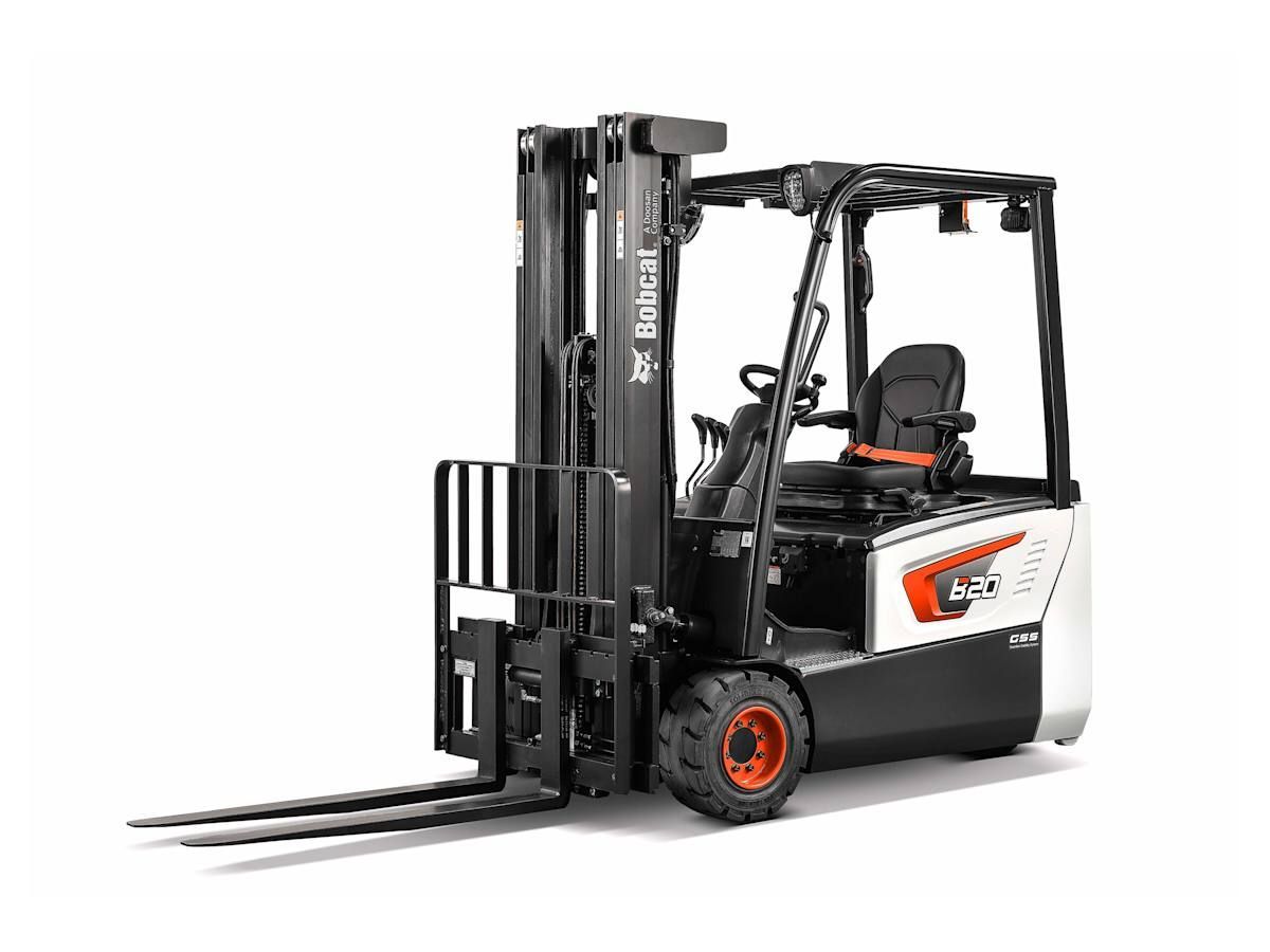 A forklift is sitting on a white surface.
