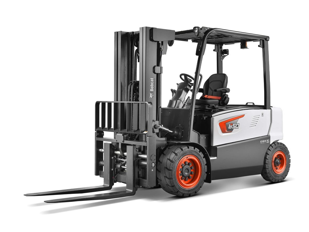 A forklift is sitting on a white surface.