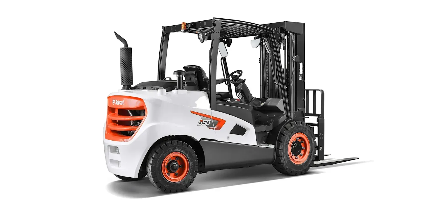 A forklift is sitting on a white surface.