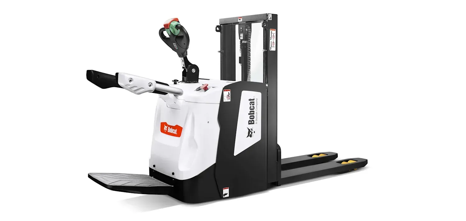 A black and white forklift is sitting on a white surface.