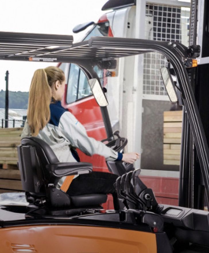 Forklift operator using a well maintained forklift with safe brakes and smooth controls, ensuring workplace safety and reliability.