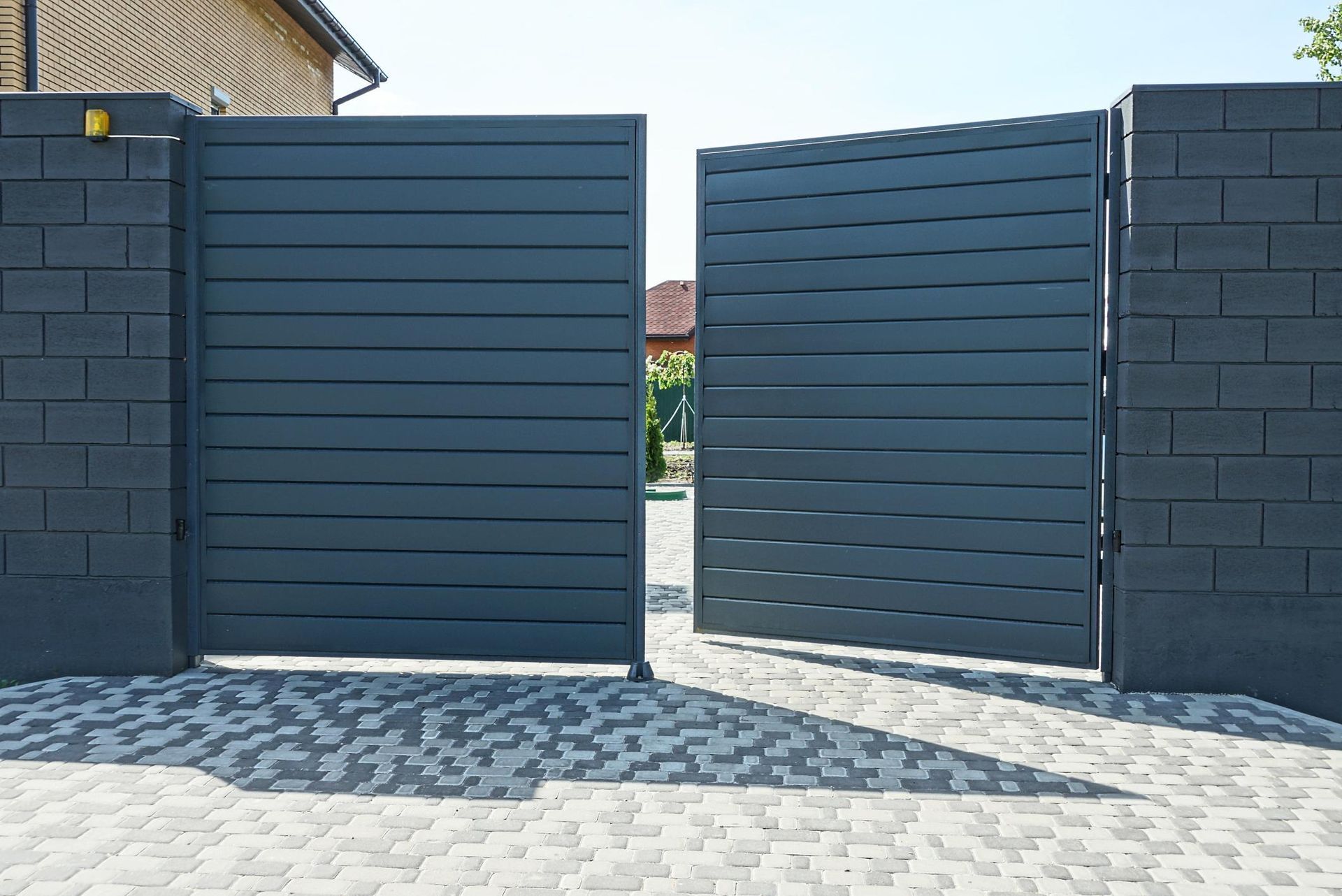 one open black metal gate
