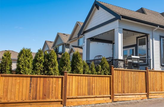 nice new wooden fence around house