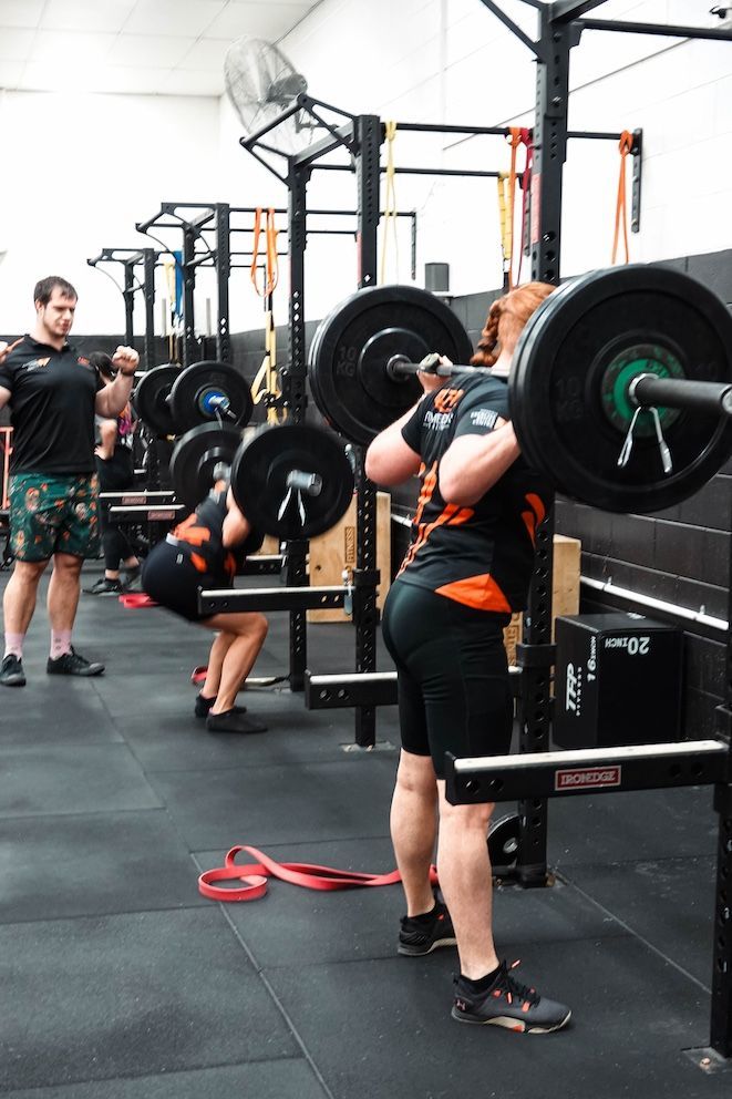 @ Ladies Doing Squats With Weights — Ultimate Results Training in Aitkenvale, QLD