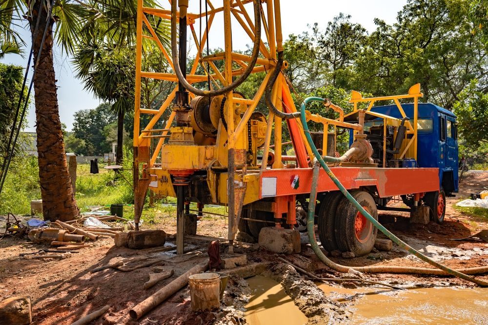 Yellow Drilling Rig on a Truck, Extracting Soil — FNQ Drilling in Cairns, QLD