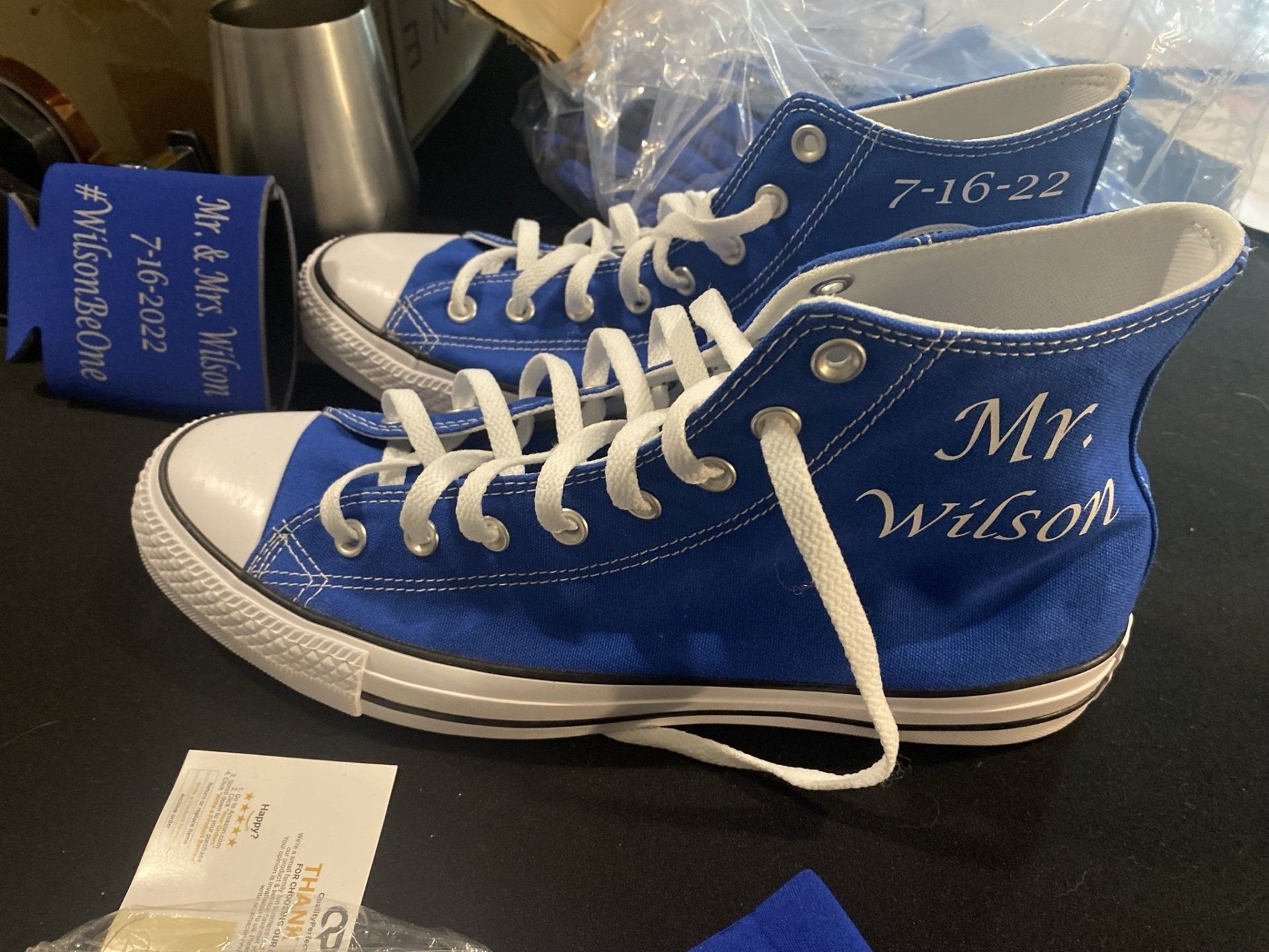 A pair of blue converse shoes with mr. wilson written on them