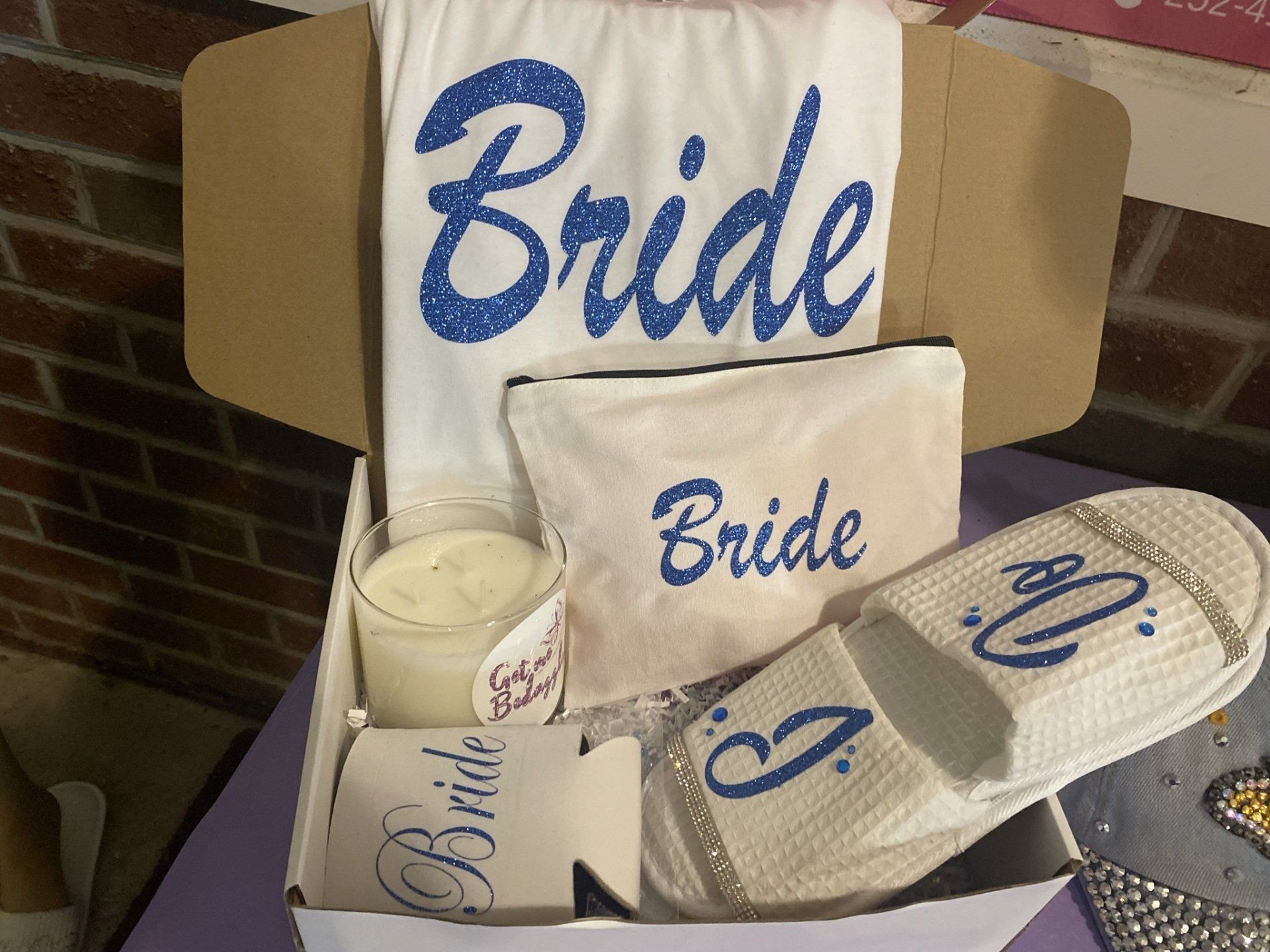 A box with a bride robe and slippers in it