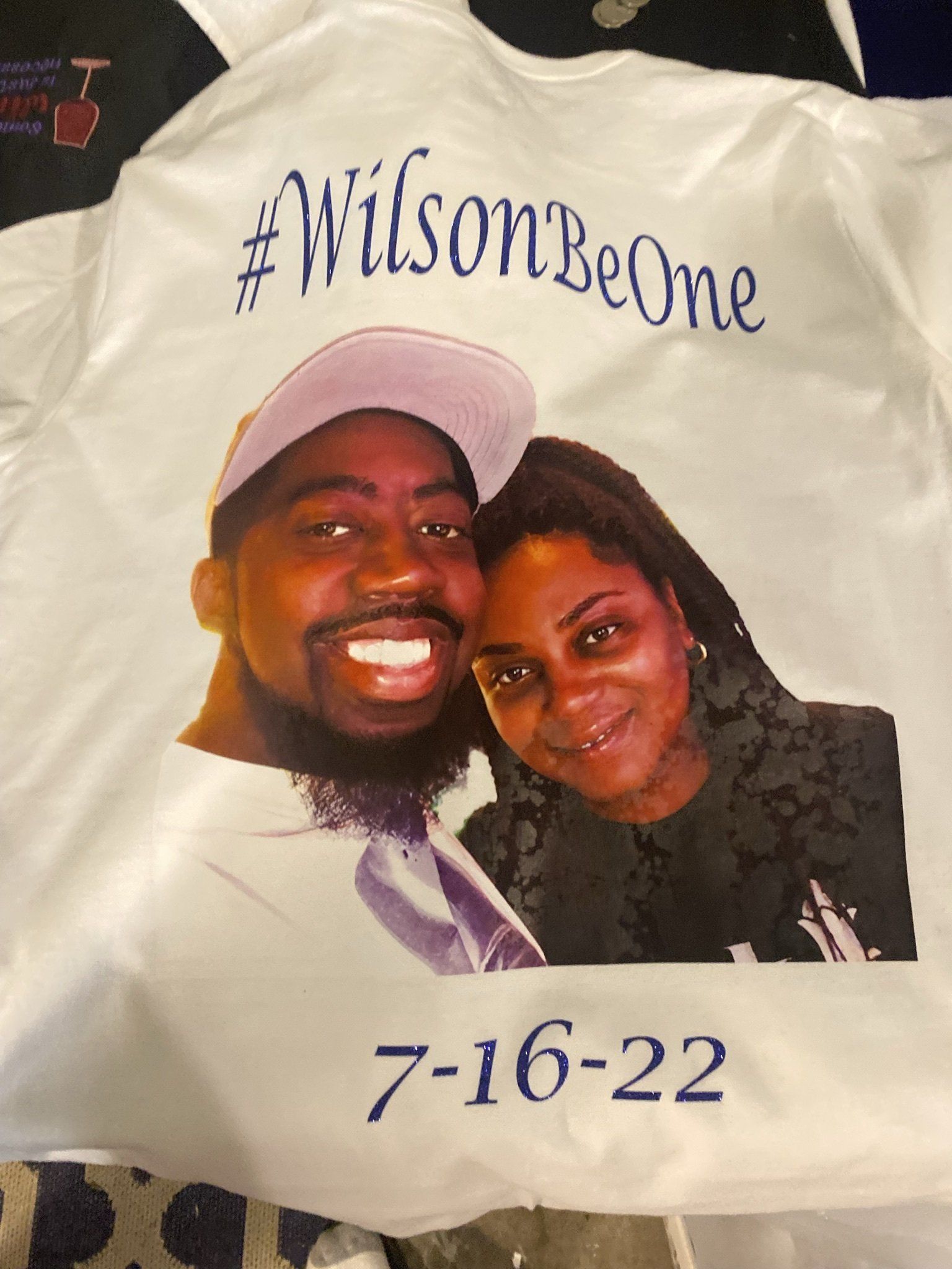 A white shirt with a picture of a man and woman on it
